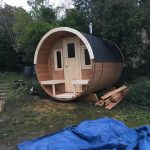 Front view of wooden barrel garden sauna 280 installed in garden