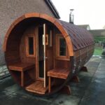 Front view of wooden barrel garden sauna 330 with balcony