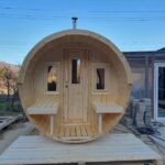 Front view of wooden barrel garden sauna fully installed outdoors