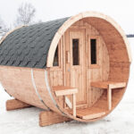 Wooden barrel garden sauna with front porch