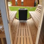 Barrel sauna 330 with balcony porch interior and bench seating