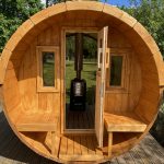 Front interior view of barrel sauna with wood-fired heater