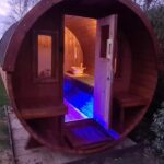 Barrel garden sauna interior at night with LED lighting