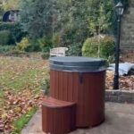 Cold Tub 100 fiberglass with wooden exterior cladding installed outdoors