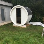 Terrace Sauna 160 standard model with white exterior installed outdoors